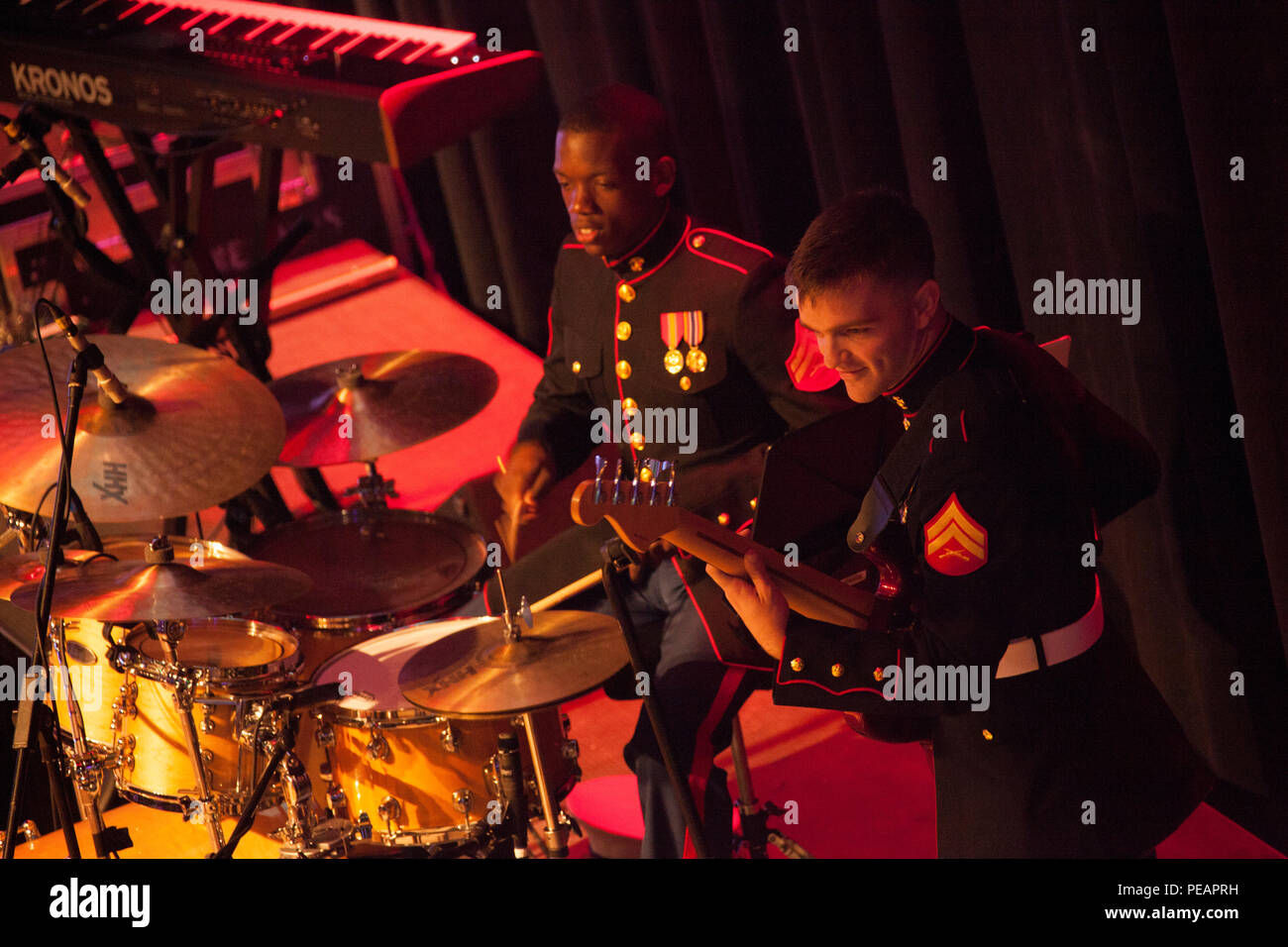 U.S. Marines Cpl. Randy West (Left), Percussionist, and Cpl. Scott Wente (right), Electric Guitarist, with Marine Corps Band New Orleans performs for the celebration of the 240th Marine Corps Birthday Ball at Mardi Gras World, New Orleans, La., Nov. 21, 2015. This year’s celebration honors those past, present, and future Marines throughout history and marks the 240th Marine Corps Birthday since its founding on Nov. 10, 1775. (U.S. Marine Corps photo by Kimberly Aguirre/Released) Stock Photo