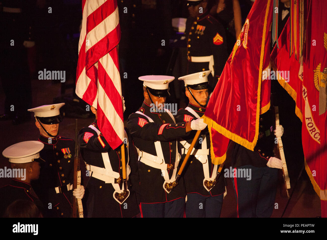 U.S. Marines with the Marine Forces Reserve color guard present the colors during the playing of the National Anthem during the celebration of the 240th Marine Corps Birthday Ball at Mardi Gras World, New Orleans, La., Nov 21, 2015. This year’s celebration honors those past, present, and future Marines throughout history and marks the 240th Marine Corps Birthday since its founding on Nov. 10, 1775. (U.S. Marine Corps photo by Kimberly Aguirre/Released) Stock Photo