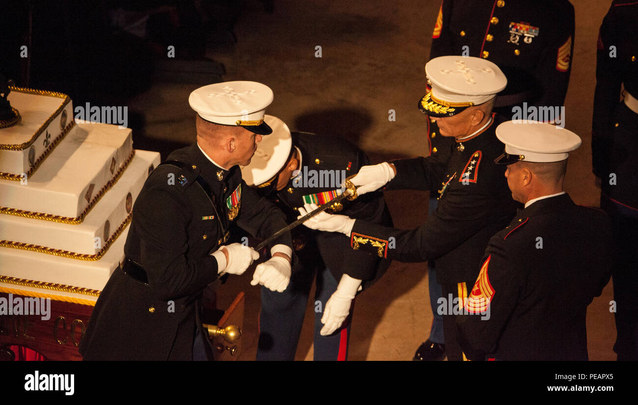 U.S. Marine Lt. Gen. Rex C. McMillian, Commander of Marine Forces Reserve and Marine Forces North, receives the Non-Commissioned officer sword in preparation to slice the birthday cake during the celebration of the 240th Marine Corps Birthday Ball at Mardi Gras World, New Orleans, La., Nov 21, 2015. This year’s celebration honors those past, present, and future Marines throughout history and marks the 240th Marine Corps Birthday since its founding on Nov. 10, 1775. (U.S. Marine Corps photo by Kimberly Aguirre/Released) Stock Photo