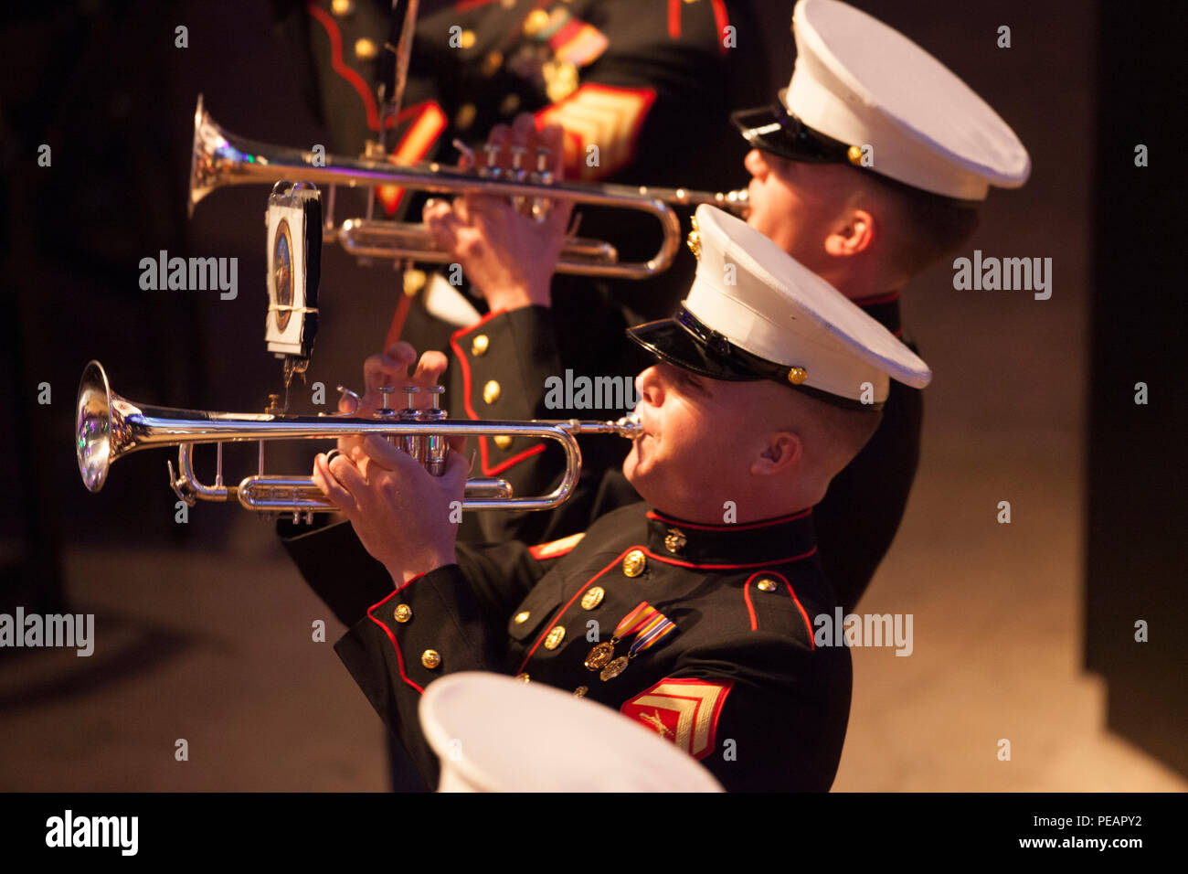 U.S. Marine Cpl. Jordan Garder, Marine Corps Band New Orleans, plays the trumpet during the band performance for the celebration of the 240th Marine Corps Birthday Ball at Mardi Gras World, New Orleans, La., Nov. 21, 2015. This year’s celebration honors those past, present, and future Marines throughout history and marks the 240th Marine Corps Birthday since its founding on Nov. 10, 1775. (U.S. Marine Corps photo by Kimberly Aguirre/Released) Stock Photo