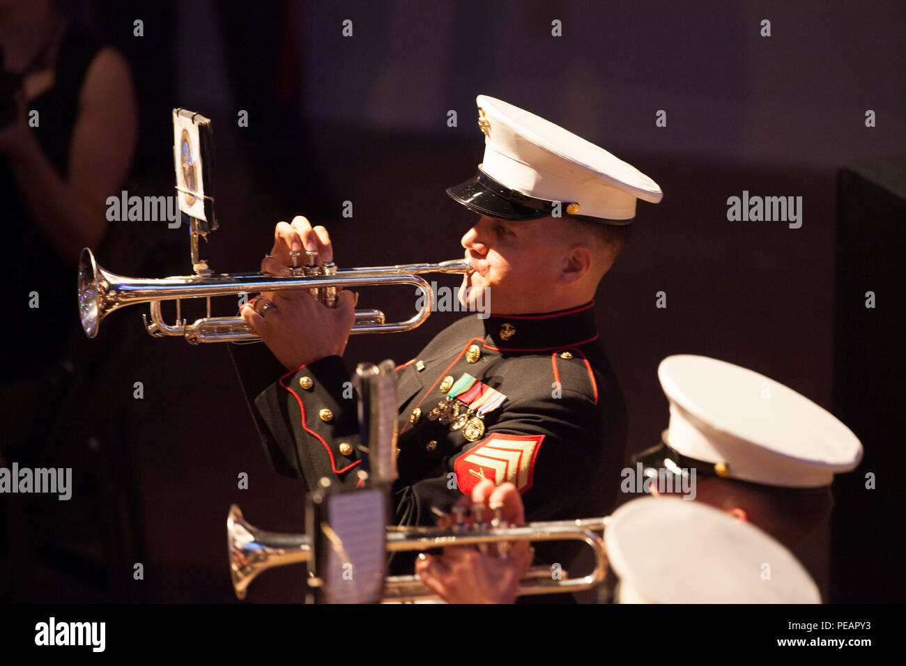 U.S. Marine Sgt. Charles Mekealin, Marine Corps Band New Orleans, plays the trumpet during the band performance for the celebration of the 240th Marine Corps Birthday Ball at Mardi Gras World, New Orleans, La., Nov. 21, 2015. This year’s celebration honors those past, present, and future Marines throughout history and marks the 240th Marine Corps Birthday since its founding on Nov. 10, 1775. (U.S. Marine Corps photo by Kimberly Aguirre/Released) Stock Photo