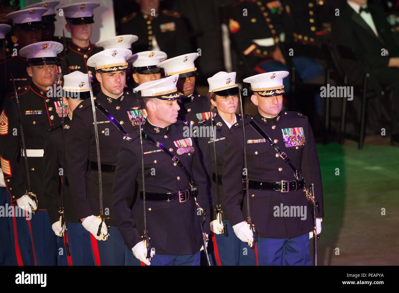 U.S. Marines with Marine Forces Reserve, march their positions during the celebration of the 240th Marine Corps Birthday Ball at Mardi Gras World, New Orleans, La., Nov. 21, 2015. This year’s celebration honors those past, present, and future Marines throughout history and marks the 240th Marine Corps Birthday since its founding on Nov. 10, 1775. (U.S. Marine Corps photo by Kimberly Aguirre/Released) Stock Photo