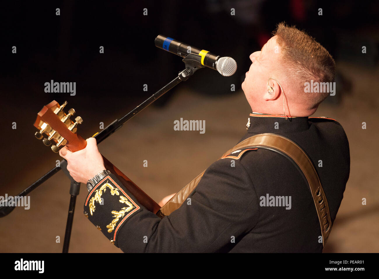 U.S. Marine Lt. Col. Michael Corrado, Deputy Assistant Chief of Staff G-3, 4th Marine Division, Marine Forces Reserve, performs his song “Stand” during the celebration of the 240th Marine Corps Birthday Ball at Mardi Gras World, New Orleans, La., Nov. 21, 2015. This year’s celebration honors those past, present, and future Marines throughout history and marks the 240th Marine Corps Birthday since its founding on Nov. 10, 1775. (U.S. Marine Corps photo by Kimberly Aguirre/Released) Stock Photo