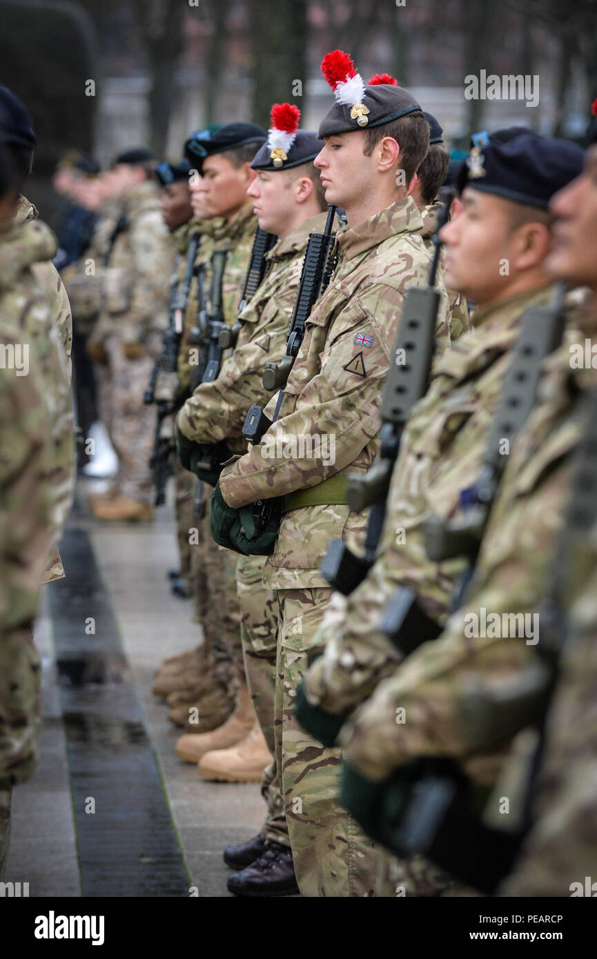 British soldiers assigned to the Royal Regiment of Fusiliers stand in formation in for the Lithuanian Armed Forces Day parade in Cathedral Square, Vilnius, Lithuania, Nov. 23, 2015. The Gurkha Signals have almost finished Headquarters Allied Rapid Reaction Corps’ (ARRC) exercise Arrcade Fusion 15. Arrcade Fusion is an annual NATO ARRC-led, multinational command post exercise designed to increase interoperability between NATO member nation forces. (DoD photo by Sgt. Mike O'Neill RLC ABIPP) Stock Photo