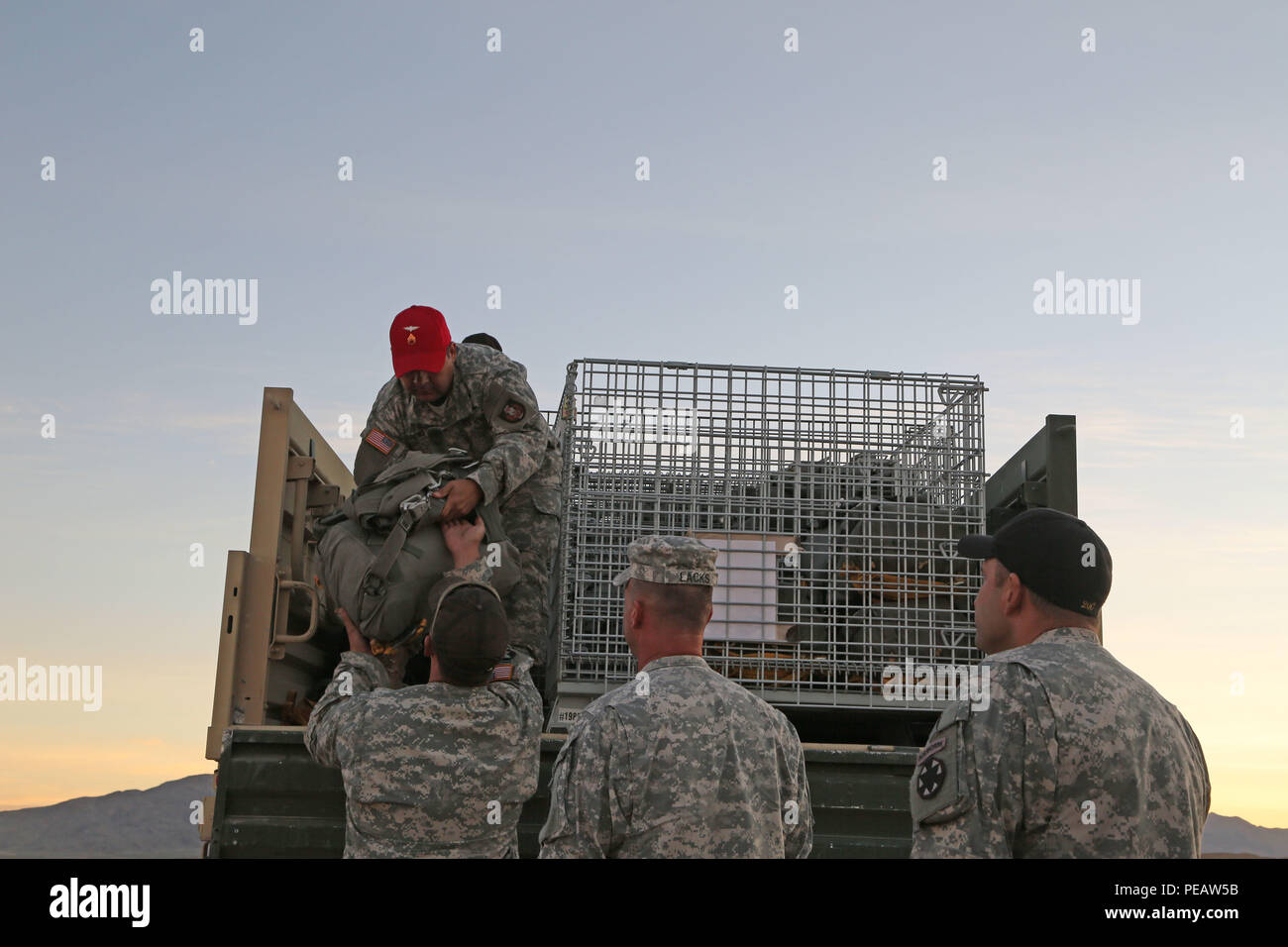 U.S. Army paratroopers from the Tarantula Team, Operations Group, National Training Center, grab