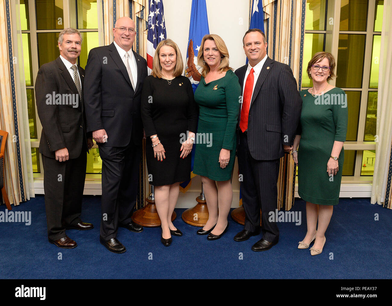 Secretary of the Air Force Deborah Lee James stands with, from left, John  Wood, Chairman of the board, TAPS; David Coker, president, Fisher House  Foundation, Inc.; Bonnie Carroll, founder, TAPS; Brian Gawe,