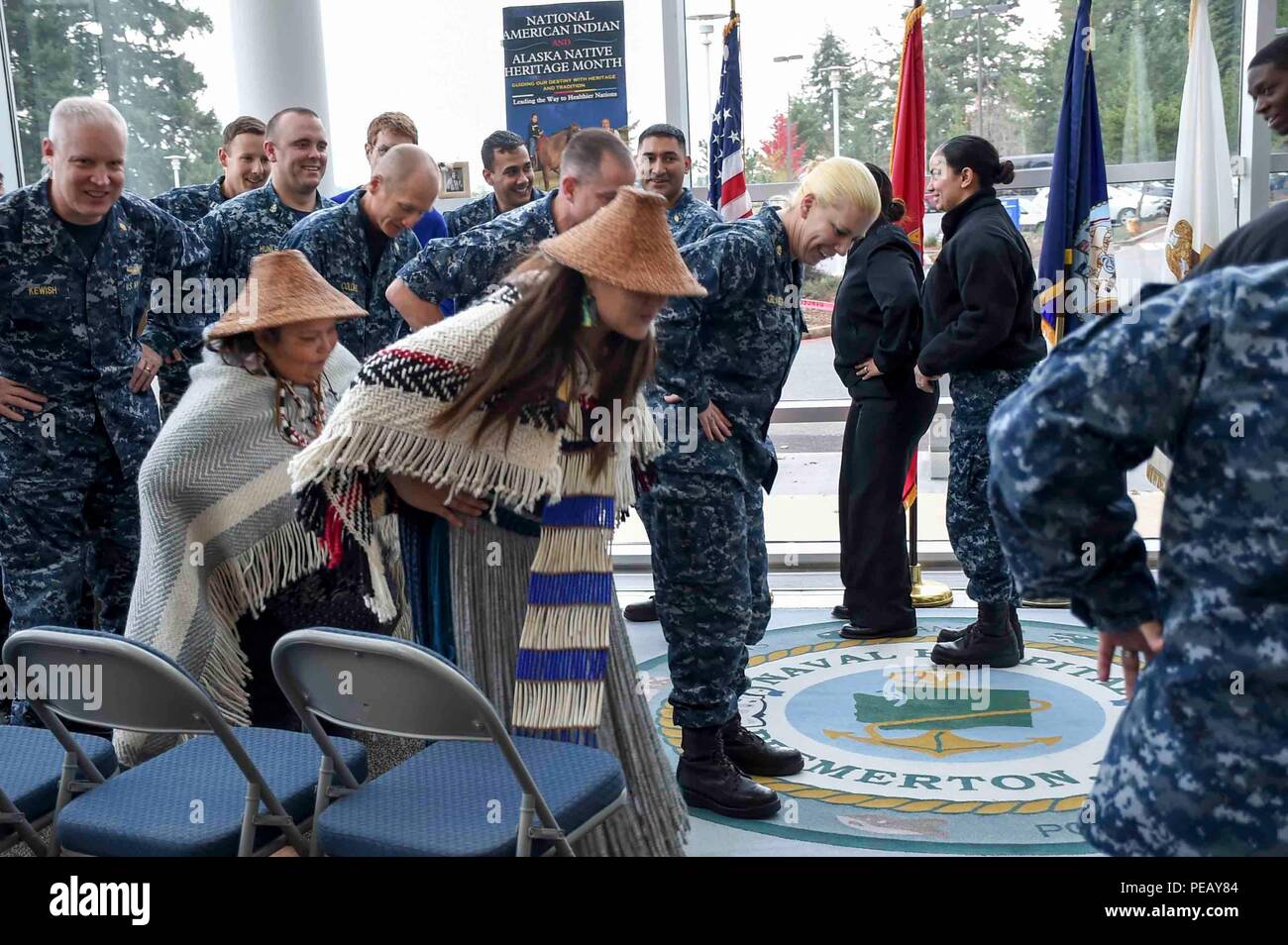 Naval Hospital Bremerton (Nov. 23, 2015) Staff members perform a traditional tribal dance at Naval Hospital Bremerton for a Native American Heritage Ceremony in honor of Native American Heritage Month. (U.S. Navy photo by Mass Communication Specialist 3rd Class Shauna C. Sowersby/Released) Stock Photo