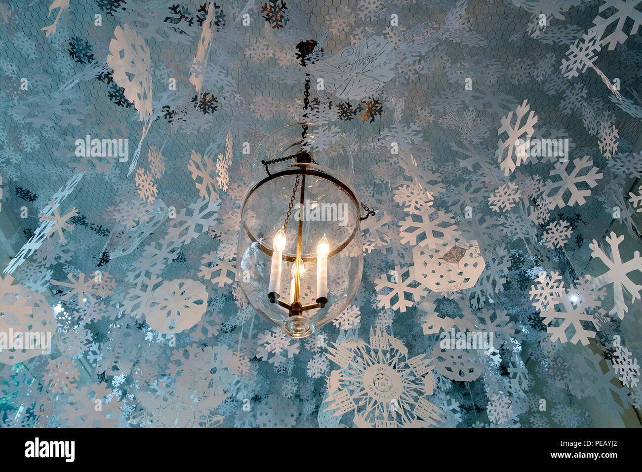 Hand Made Paper Snowflakes Hang From The Ceiling In The East