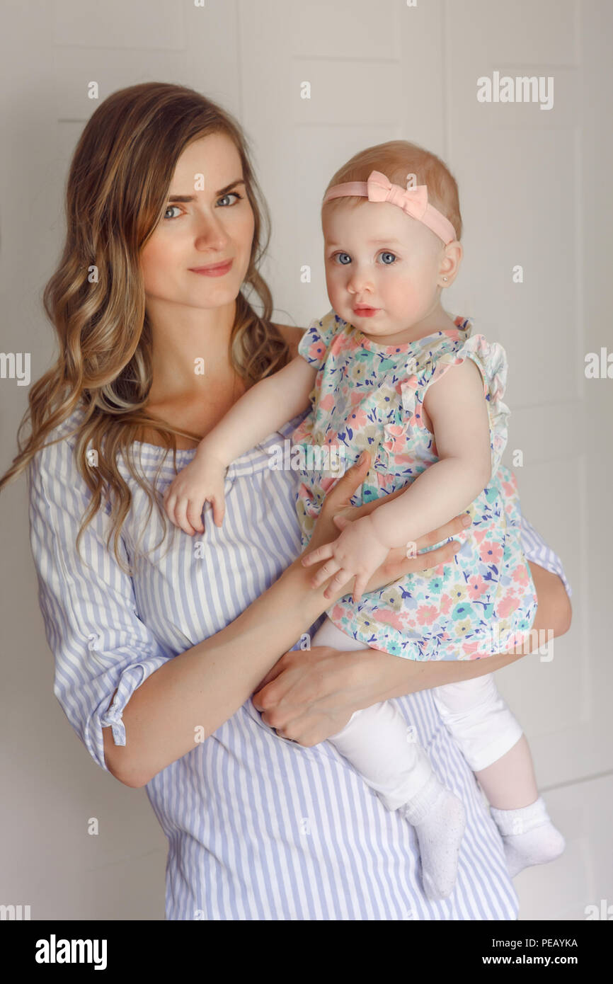 Closeup Portrait Of Beautiful White Caucasian Woman Mother Holding