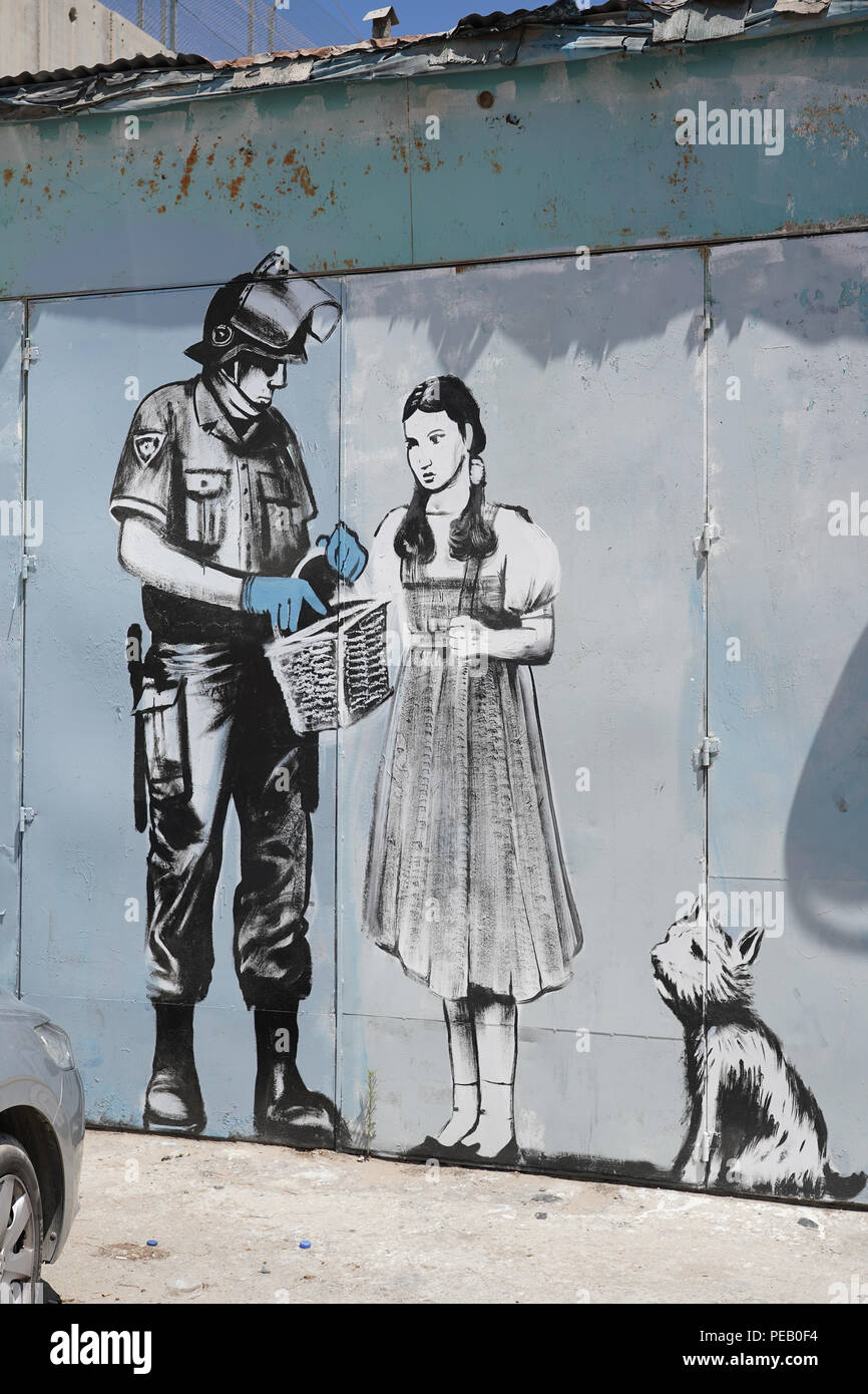 Graffiti by Banksy on the wall of separation in Bethlehem. From a series of  travel photos taken in Jerusalem and nearby areas. Photo date: Wednesday  Stock Photo - Alamy