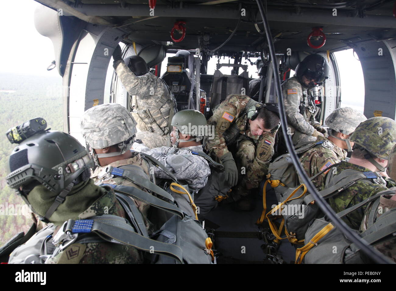 Military members conduct an airborne operation for Operation Toy Drop