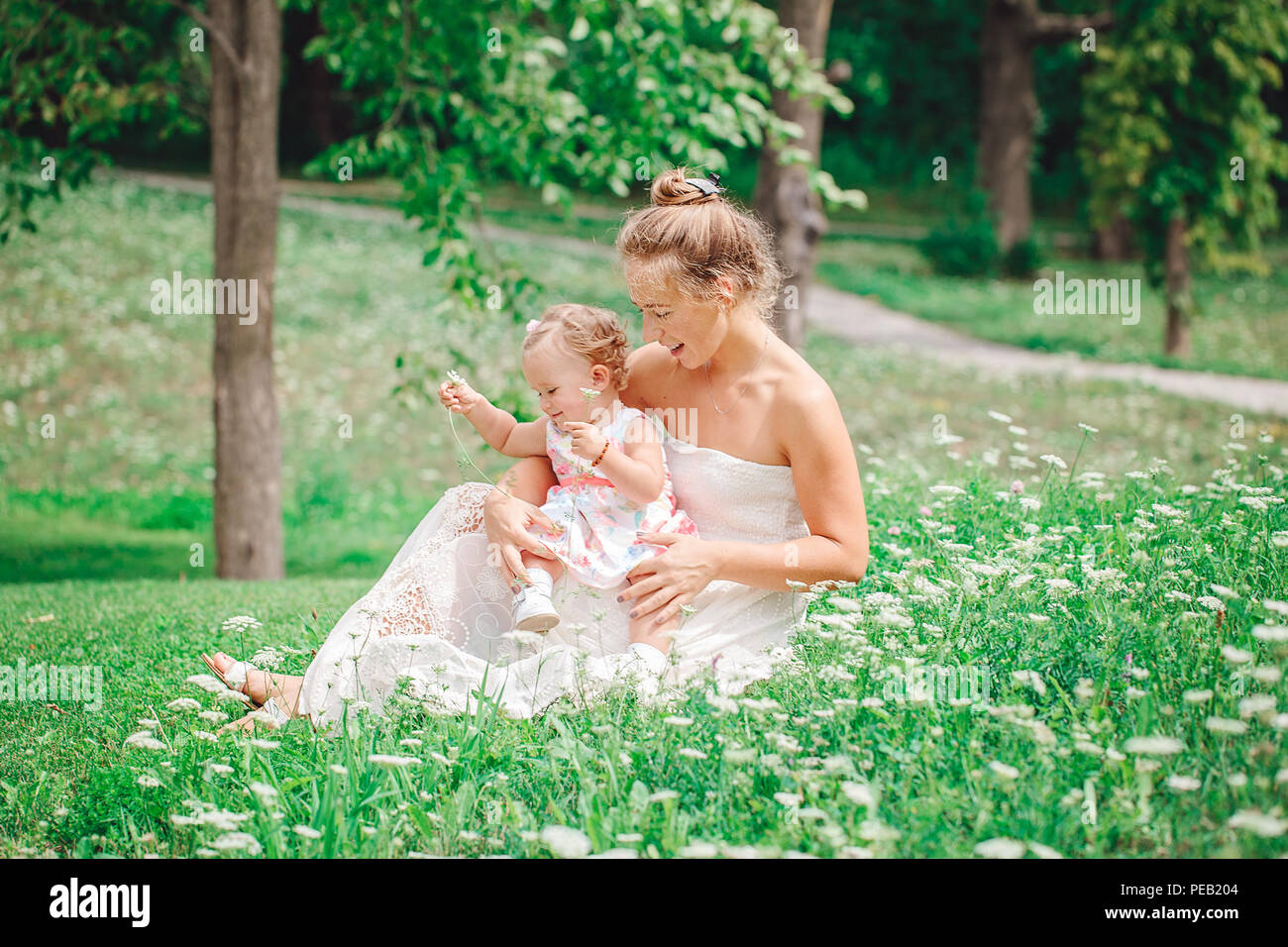 group-of-two-people-white-caucasian-mother-and-baby-girl-child-in