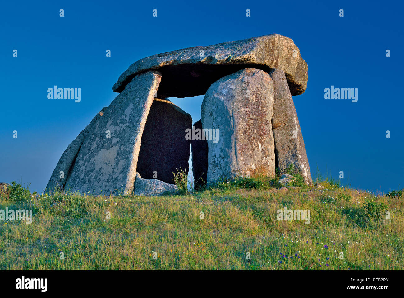 Prehistoric dolmen on a hill with blue sky Stock Photo