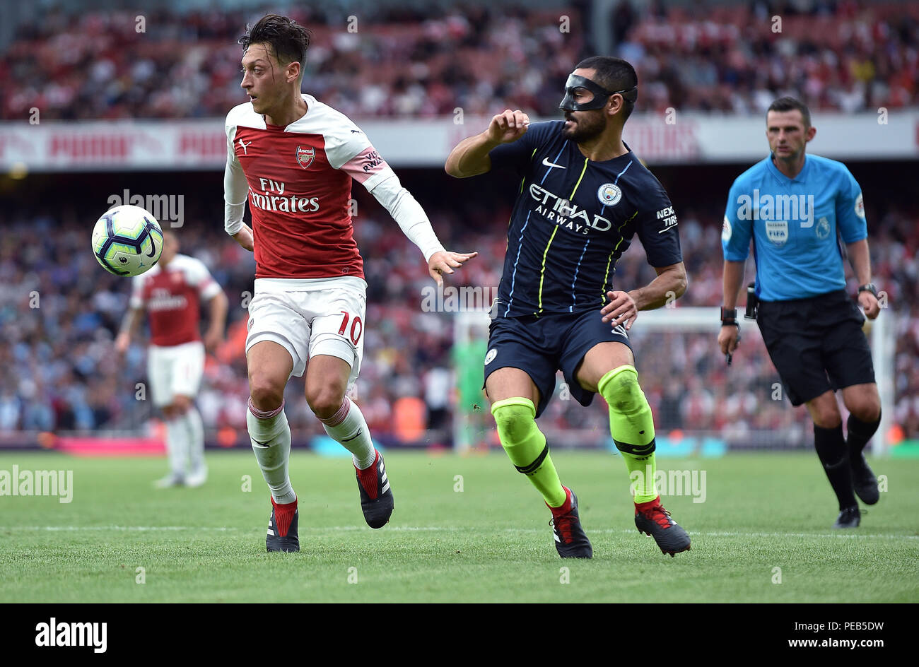 Mesut Ozil Of Arsenal Is Challenged By Ilkay Gundogan Of Manchester City Arsenal V Manchester City Arsenal V Manchester City Premier League 12 August 2018 Gbc10806 Premier League 12 08 18 Strictly Editorial Use Only