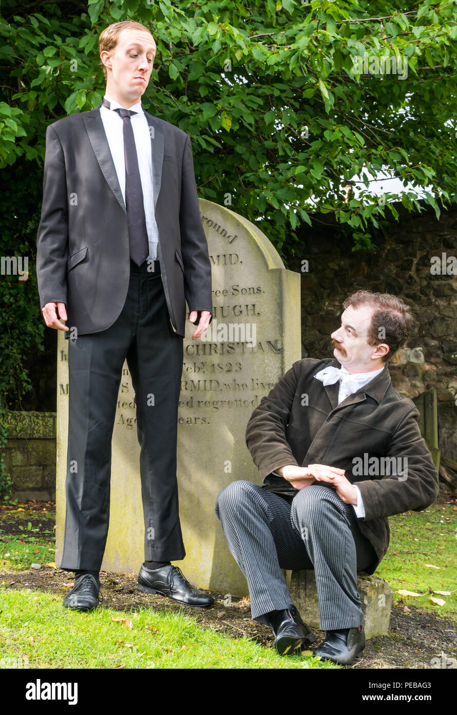 Edinburgh, Scotland, UK. 14th August 2018. Edinburgh Fringe Festival Canongate churchyard, Edinburgh, Scotland, United Kingdom. Winners of Show of the Week Award at VAULT Festival 2018, Dominic Allen and Simon Maeder present Providence, a dark comedy about the life and works of America’s horror writer, HP Lovecraft by Turnpike Productions. Simon Maeder plays HP Lovecraft and Dominic Allen plays Edgar Allan Poe Stock Photo