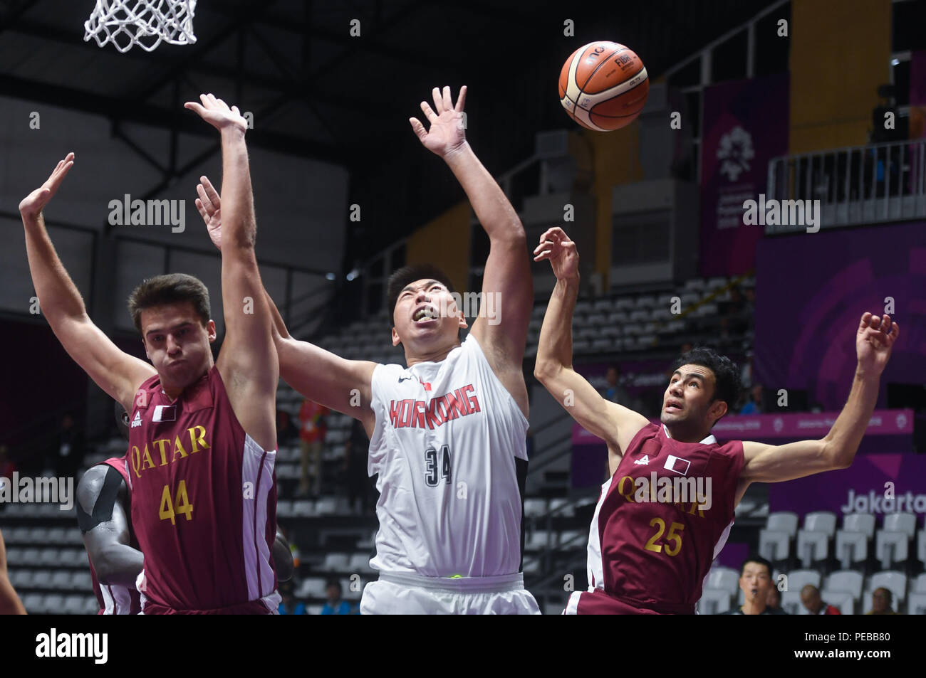 Jakarta. 14th Aug, 2018. Szeto Wai Kit(C) of China's Hong Kong competes  with Qatar's Faris Avdic (L) and Khaled Abdelbaset during the men's  basketball 5x5 Group C match between Qatar and China's