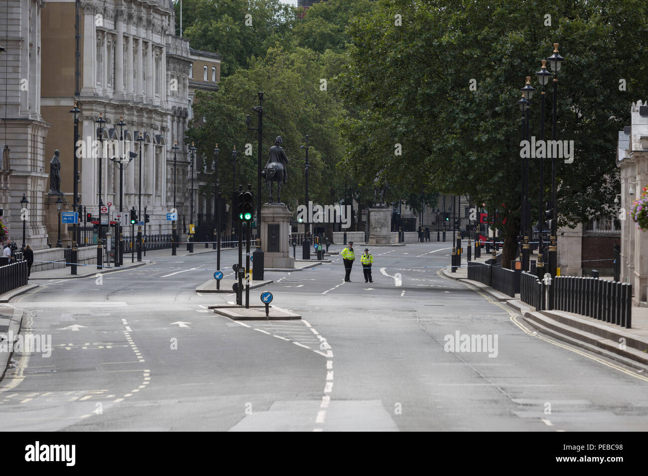 London, UK 14th August 2018: Police block Whitehall as Westminster experiences a lockdown with extensive cordons and the closure of many streets after what police are calling a terrorist incident in which a car was crashed into security barriers outside parliament in central London, on 14th August 2018, in London, England. Photo by Richard Baker / Alamy Live News. Stock Photo