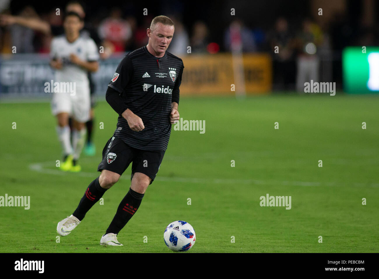Washington, United States. 14th July, 2018. D.C. United forward Wayne Rooney (9) dribbles during the game between D.C. United and Vancouver Whitecaps at Audi Filed in Washington, DC on July 14, 2018. D.C. This is D.C. United's first game at Audi Field. Credit: The Photo Access/Alamy Live News Stock Photo