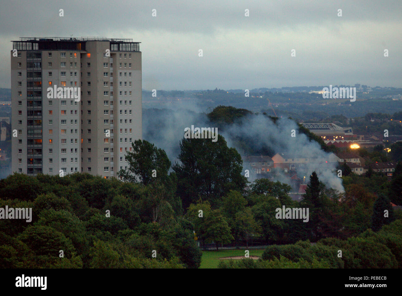 Glasgow, Scotland, UK. 14th August, 2018. Another fire in the city known as the tinderbox due to a long history of disasters finds a drifting of smoke on Lincoln Avenue towers from the clubhouse of Knightswood golf course yet another even though it is  only a local one burning viewed from a mile away. Gerard Ferry/Alamy news Credit: gerard ferry/Alamy Live News Stock Photo