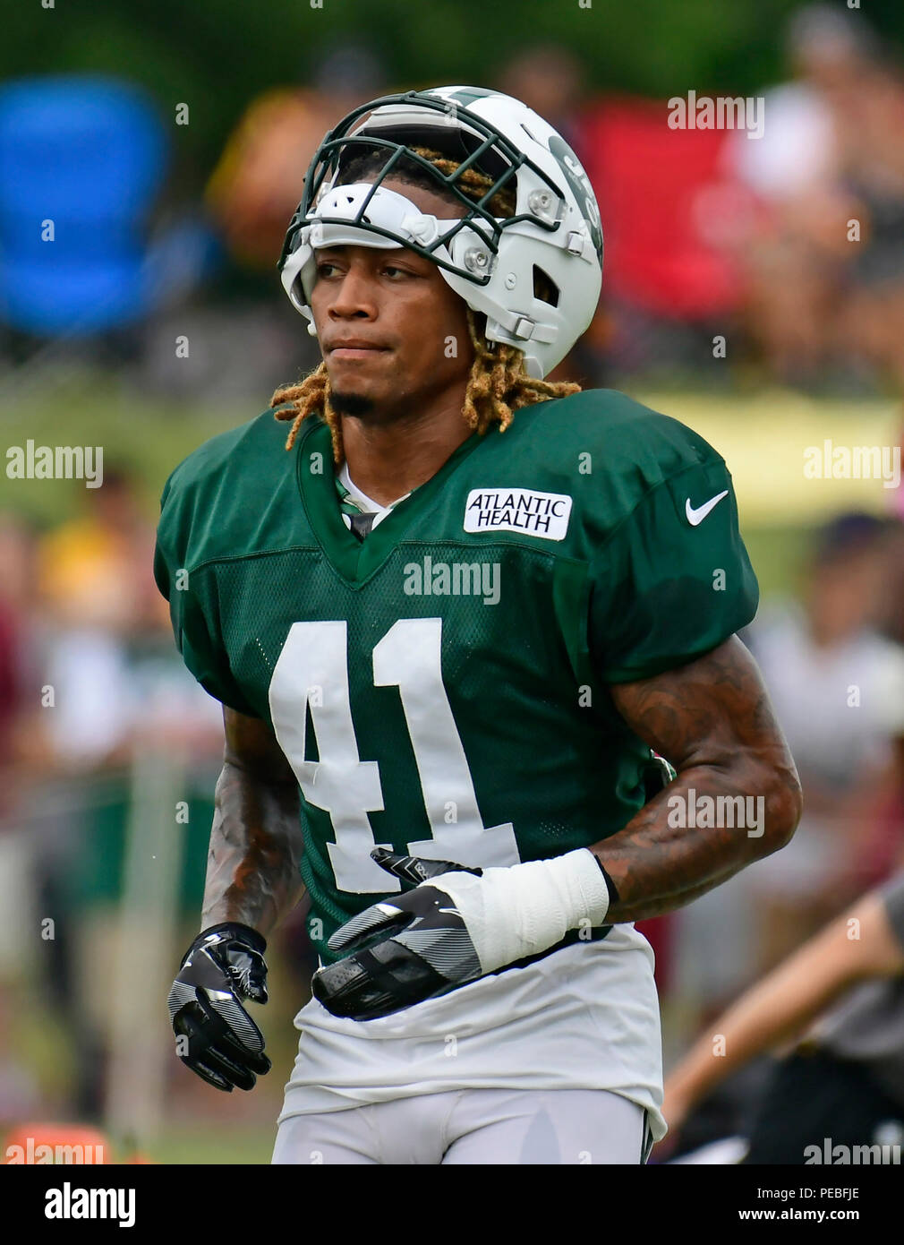 New York Jets Buster Skrine 41 intercepts a pass to New England Patriots Phillip Dorsett 13 during the first half of an NFL football game Sunday Oct. 15 2017 in East Rutherford