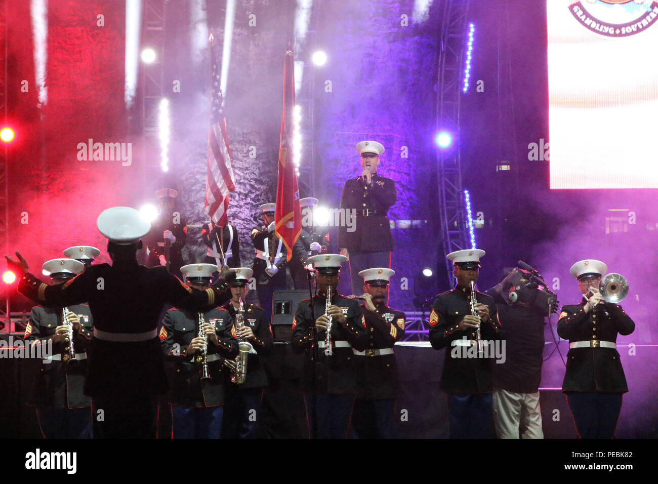 Chief Warrant Officer 3 Michael Smith, Marine Corps Band New Orleans officer in charge, sings the national anthem during the Bayou Classic Battle of the Bands show on Nov. 27, 2015. The Marine Corps has been partners with the Bayou Classic for the past 15 years as a way to connect and strengthen the United States Marine Corps’ relationship with Historically Black College Universities while also reinforcing the idea of the armed services as a viable career option for college and high school graduates. (U.S. Marine Corps photo by Sgt. Rubin J. Tan/Released) Stock Photo