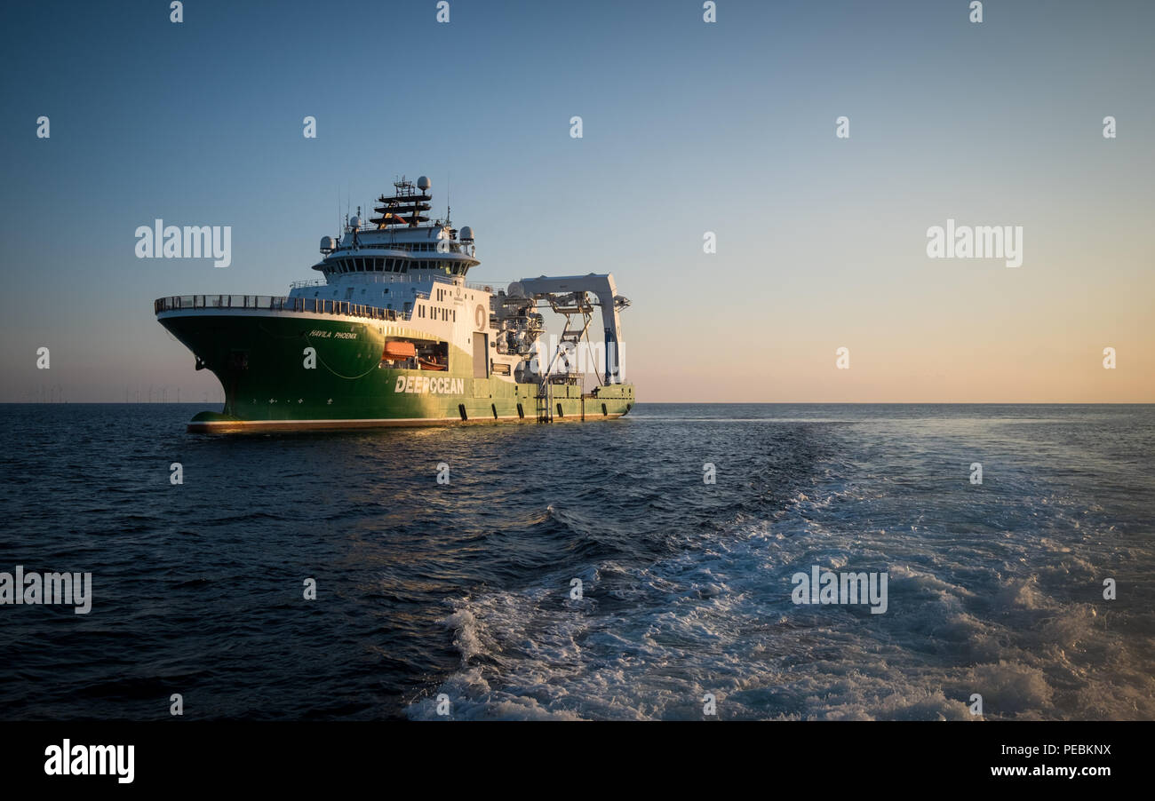 A dawn view of the offshore construction support vessel, Havila Phoenix, working on the Race Bank offshore wind farm in the North Sea, UK Stock Photo