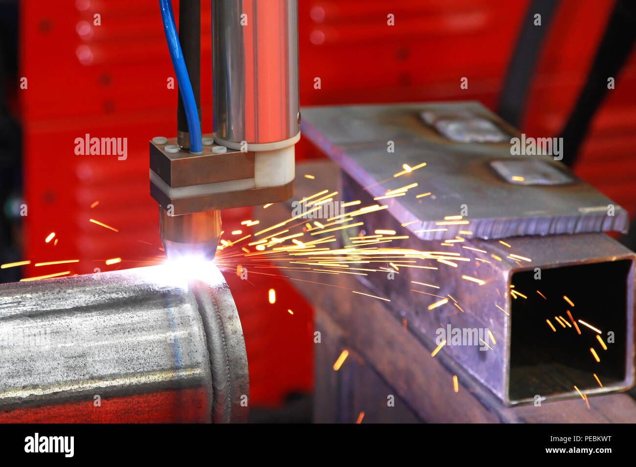 Plasma welding pipes with sparks Stock Photo