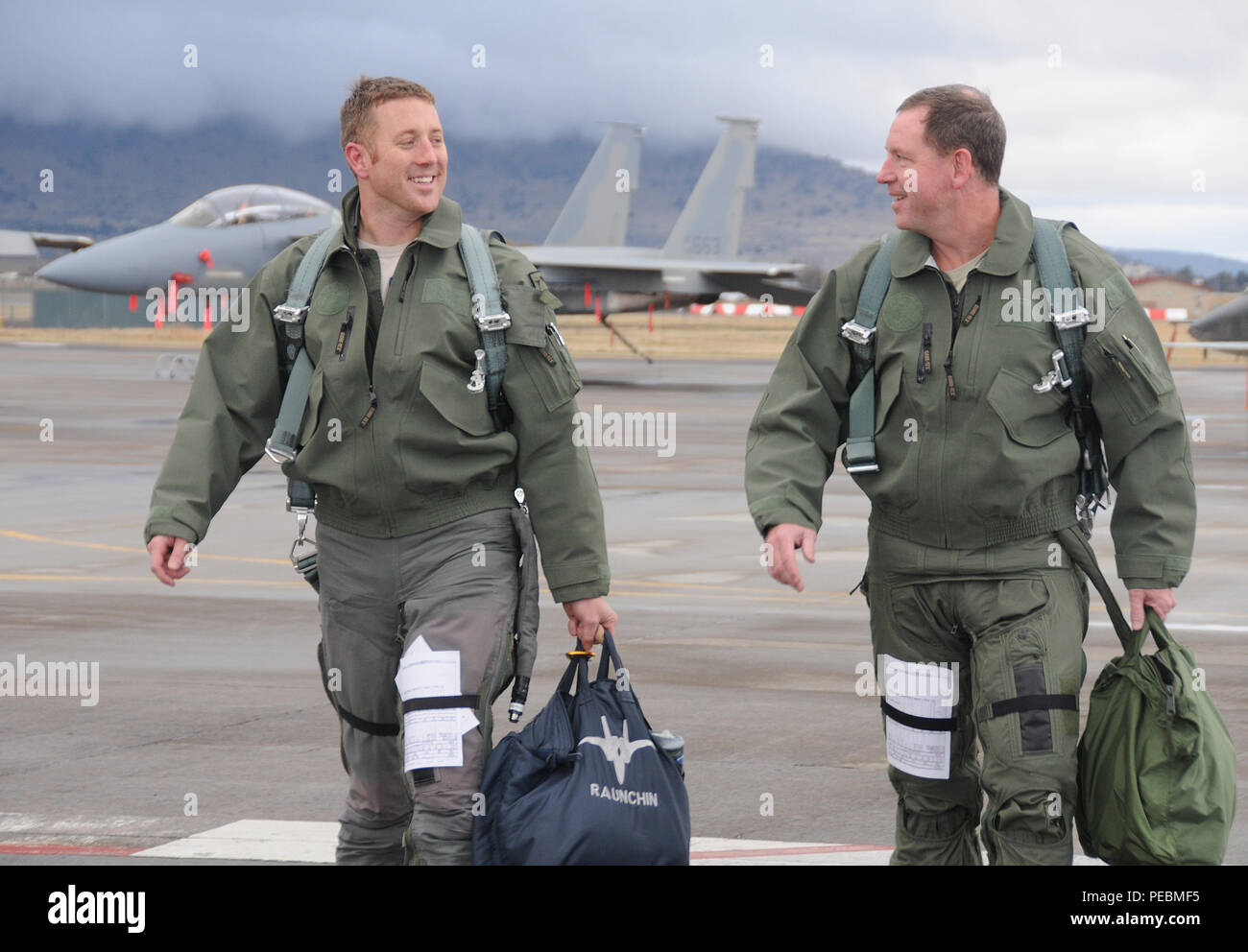 us-air-force-capt-ryan-reeves-173rd-fighter-wing-f-15-pilot-and-maj-gen-james-hecker-19th-air-force-commander-walk-off-the-flight-line-following-their-flight-in-an-f-15-eagle-at-kingsley-field-in-klamath-falls-ore-nov-19-2015-hecker-is-a-former-f-15-eagle-pilot-and-had-the-chance-to-get-back-into-the-seat-of-the-eagle-during-his-visit-to-the-173rd-fw-hecker-spent-two-days-at-kingsley-field-seeing-the-wings-mission-first-hand-meeting-the-airmen-and-learning-about-the-issues-they-face-us-air-national-guard-photo-by-master-sgt-jennifer-shirarreleased-PEBMF5.jpg