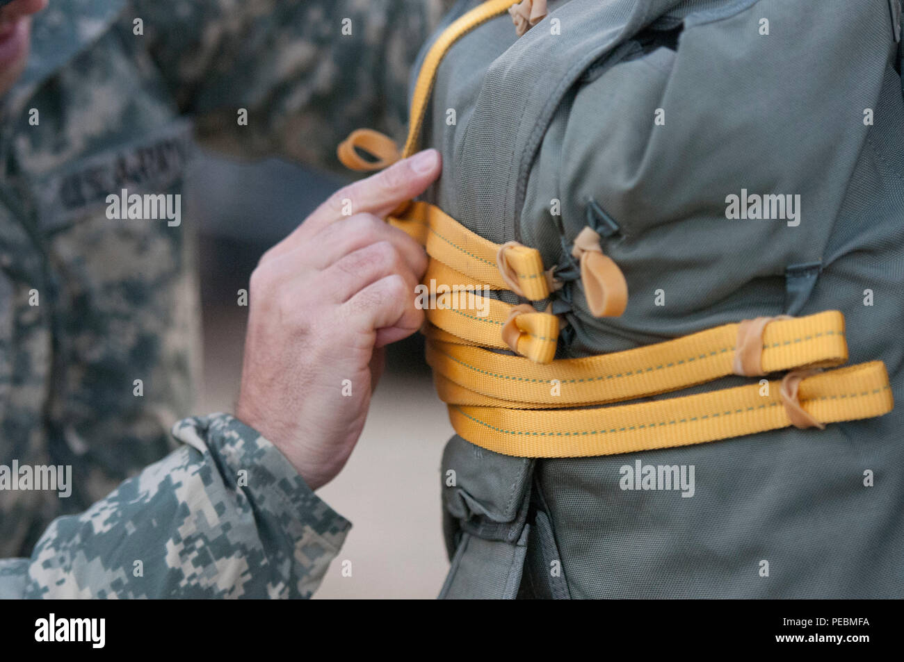 Partner nation and U.S. jumpmasters conduct final checks before sending troops on a UH60 Black