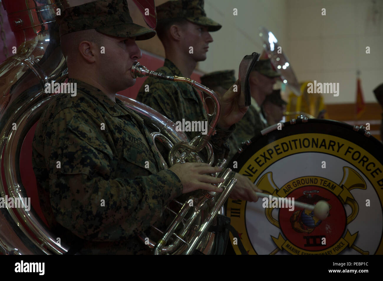 The III Marine Expeditionary Force Band performs for 3d Marines Expeditionary Brigade’s change of command ceremony Dec. 7 at Camp Courtney. Brig. Gen. John M. Jansen accepted the responsibility from Brig. Gen. Paul J. Kennedy as 3d MEB’s commanding general. Jansen was previously the assistant deputy commandant for Programs and Resources for Headquarters Marine Corps. Kennedy led 3d MEB during Operation Damayan in the Philippines and Operation Sahayogi Haat in Nepal. (U.S. Marine Corps photo by Cpl. Abbey Perria/Released) Stock Photo