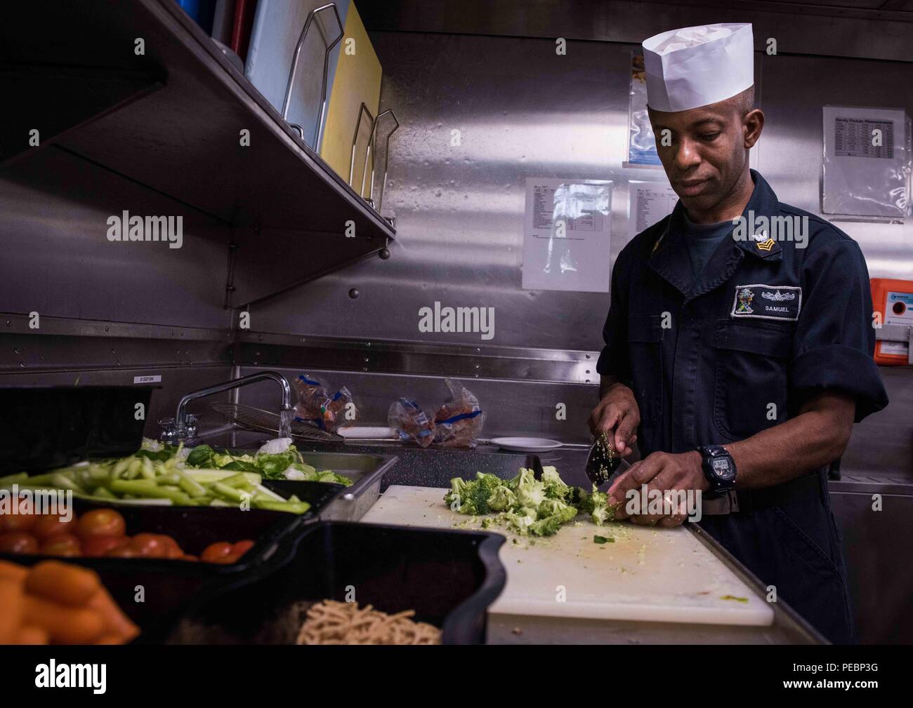 151204-N-WK391-051 PACIFIC OCEAN (Dec. 4, 2015) Culinary Specialist 1st Class Jonathan Samuel cuts broccoli for dinner aboard amphibious transport dock ship USS New Orleans (LPD 18), which is part of the Boxer Amphibious Ready Group (ARG). The Boxer ARG is off the coast of Southern California completing a certification exercise (CERTEX). CERTEX is the final evaluation of the 13th Marine Expeditionary Unit (13th MEU) and Boxer ARG prior to deployment and is intended to certify their readiness to conduct integrated missions across the full spectrum of military operations. (U.S. Navy photo by Mas Stock Photo