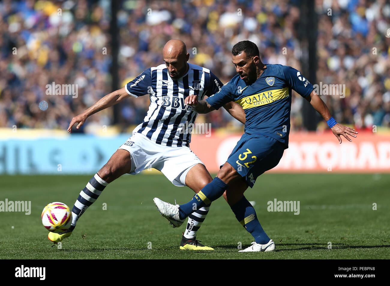 BUENOS AIRES, ARGENTINA - AUGUST 2018: Carlos Tevez (Boca Juniors) fights the ball against el Chapo (Talleres de Cordoba) on the first match for the s Stock Photo