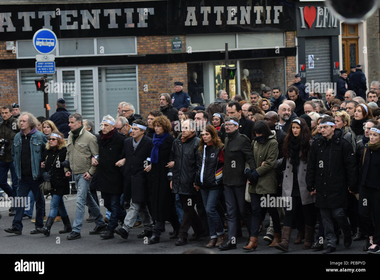 January 11, 2015 - Paris, France:  Family members and close friends of Charlie Hebdo victims, including senior cartoonist Renaud Luzier (known as 'Luz'), attend a mass unity rally following the recent Paris terrorist attacks.  Four million people demonstrated across the country in a 'Marche Republicaine' (Republican March) celebrating the nation's unity in face of terrorist threats. Thousands of people had banners or cartoons referring to Charlie Hebdo, the satirical magazine whose office was targeted by Islamist gunmen earlier in the week. La grande marche republicaine en hommage aux victimes Stock Photo