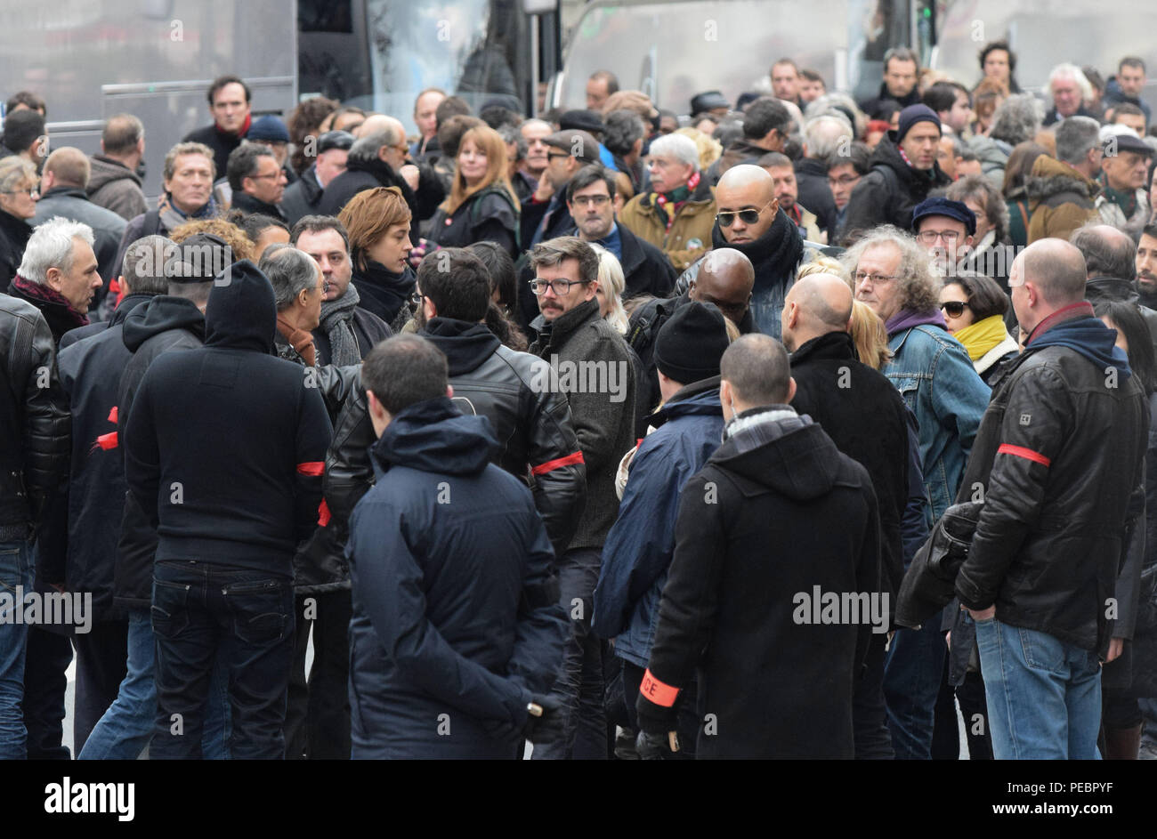 January 11, 2015 - Paris, France:  Family members and close friends of Charlie Hebdo victims, including senior cartoonist Renaud Luzier (known as 'Luz'), attend a mass unity rally following the recent Paris terrorist attacks.  Four million people demonstrated across the country in a 'Marche Republicaine' (Republican March) celebrating the nation's unity in face of terrorist threats. Thousands of people had banners or cartoons referring to Charlie Hebdo, the satirical magazine whose office was targeted by Islamist gunmen earlier in the week. La grande marche republicaine en hommage aux victimes Stock Photo