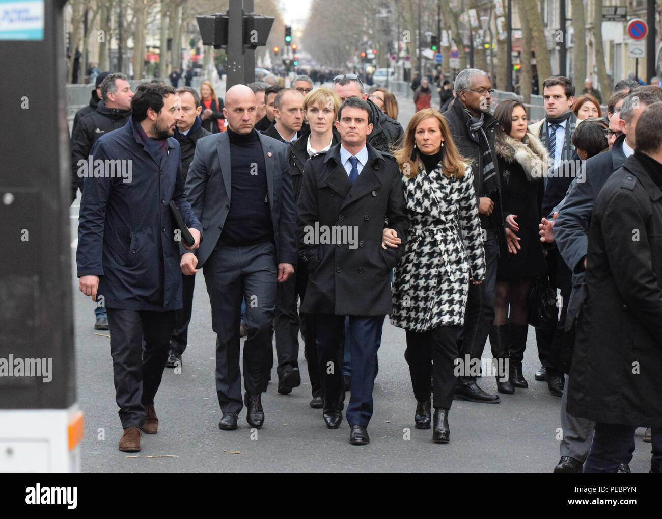 January 11, 2015 - Paris, France:  French Prime minister Manuel Valls and his wife Anne Gravoin take part in a unity march following the deadly Paris attacks. Four million people demonstrated across the country in a 'Marche Republicaine' (Republican March) celebrating the nation's unity in face of terrorist threats. Thousands of people had banners or cartoons referring to Charlie Hebdo, the satirical magazine whose office was targeted by Islamist gunmen earlier in the week. La grande marche republicaine en hommage aux victimes de l'attentat contre Charlie Hebdo a rassemble pres de 2 millions d Stock Photo