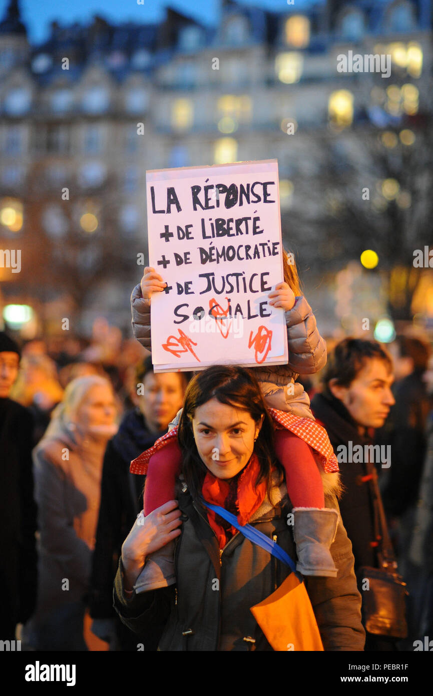 January 11, 2015 - Paris, France:  More than 1,5 million people take part in a march to support Freedom of expression and protest against terrorism in the French capital after three days of terror left 17 people dead. Four million people demonstrated across the country in a 'Marche Republicaine' (Republican March) celebrating the nation's unity in face of terrorist threats. Thousands of people had banners or cartoons referring to Charlie Hebdo, the satirical magazine whose office was targeted by Islamist gunmen earlier in the week. La grande marche republicaine en hommage aux victimes de l'att Stock Photo