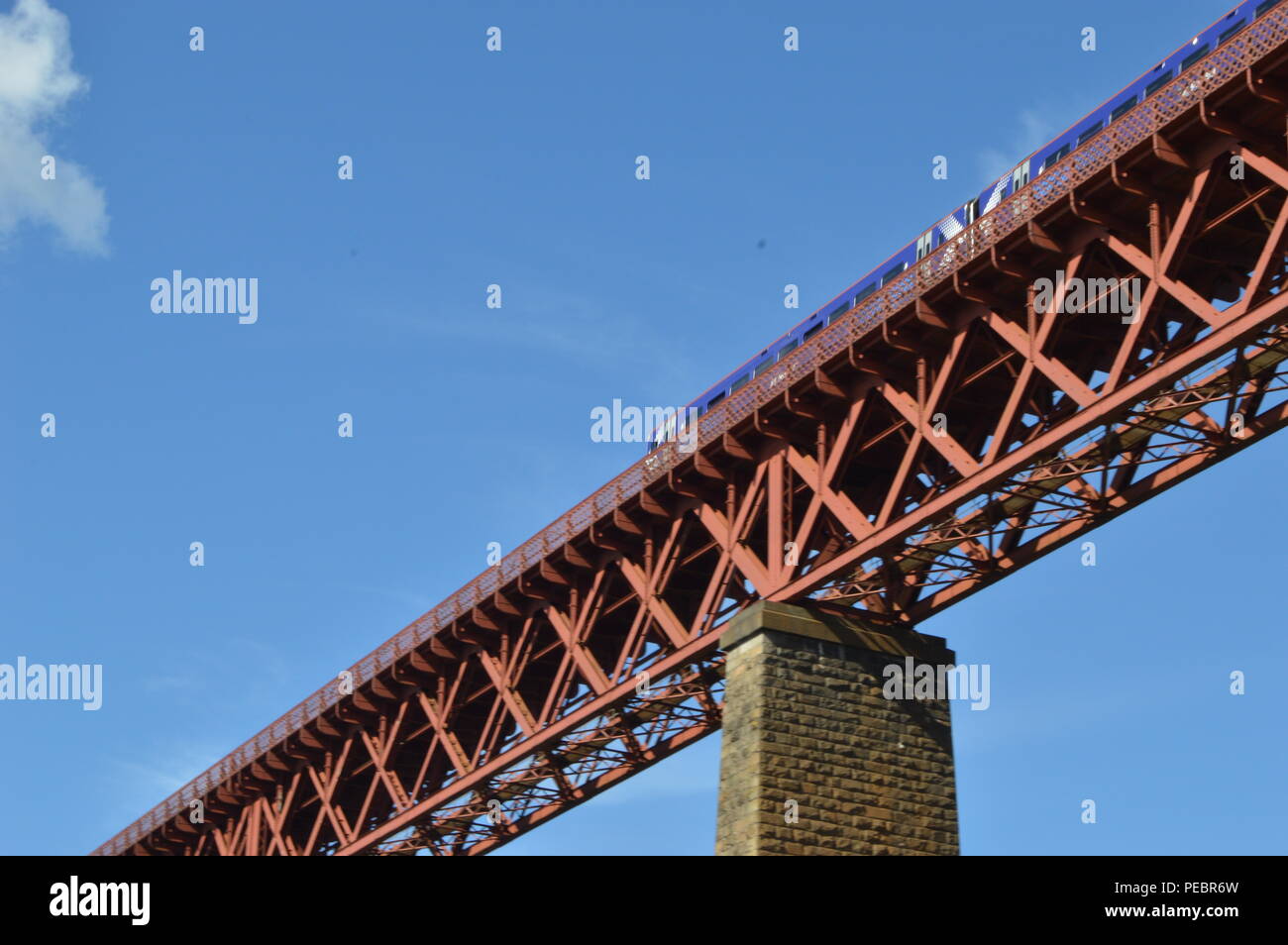 A train on the Forth Rail Bridge over the Firth of Forth connecting Edinburgh to Fife, photogrpahed from North Queensferry, Fife Stock Photo