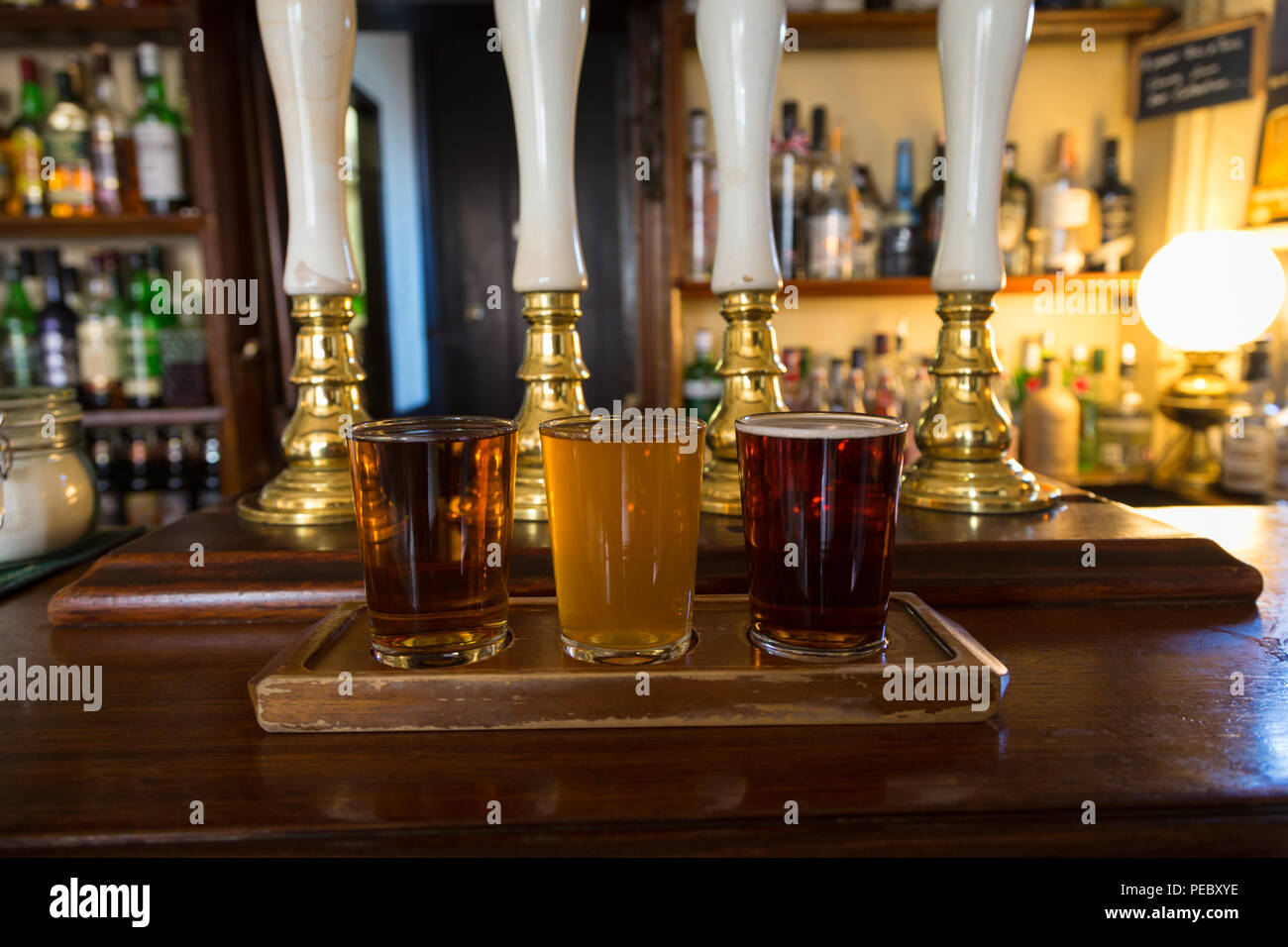 Three glasses of ale or beer in a British pub UK Stock Photo