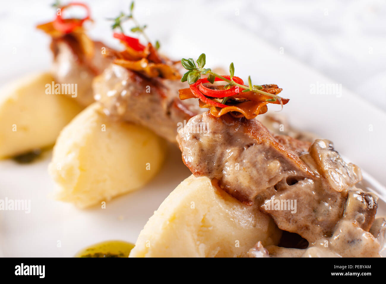 Pork Medallions with Mashed Potato and Mushrooms. Pork tenderloin on a