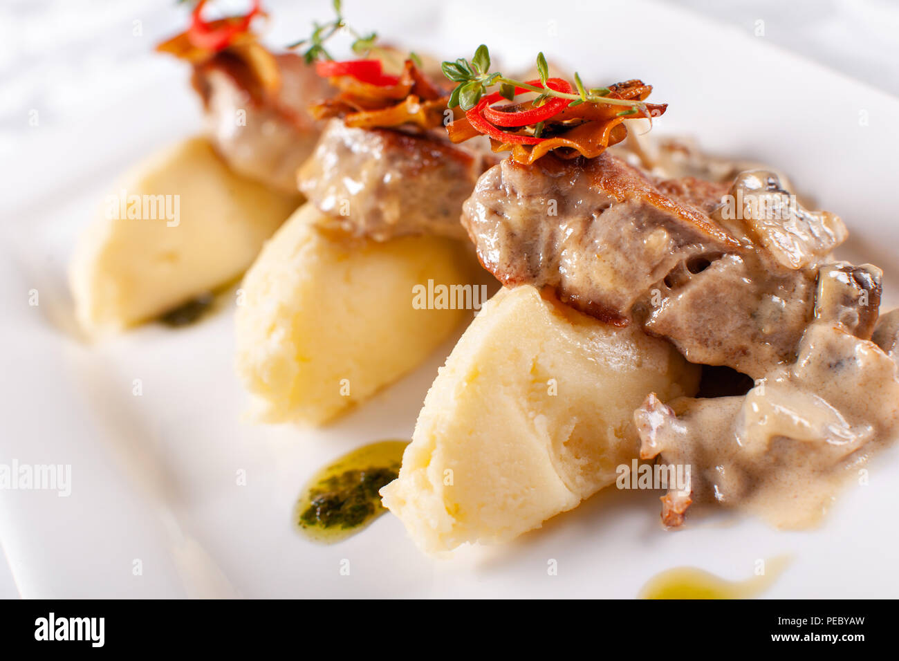 Pork Medallions with Mashed Potato and Mushrooms. Pork tenderloin on a