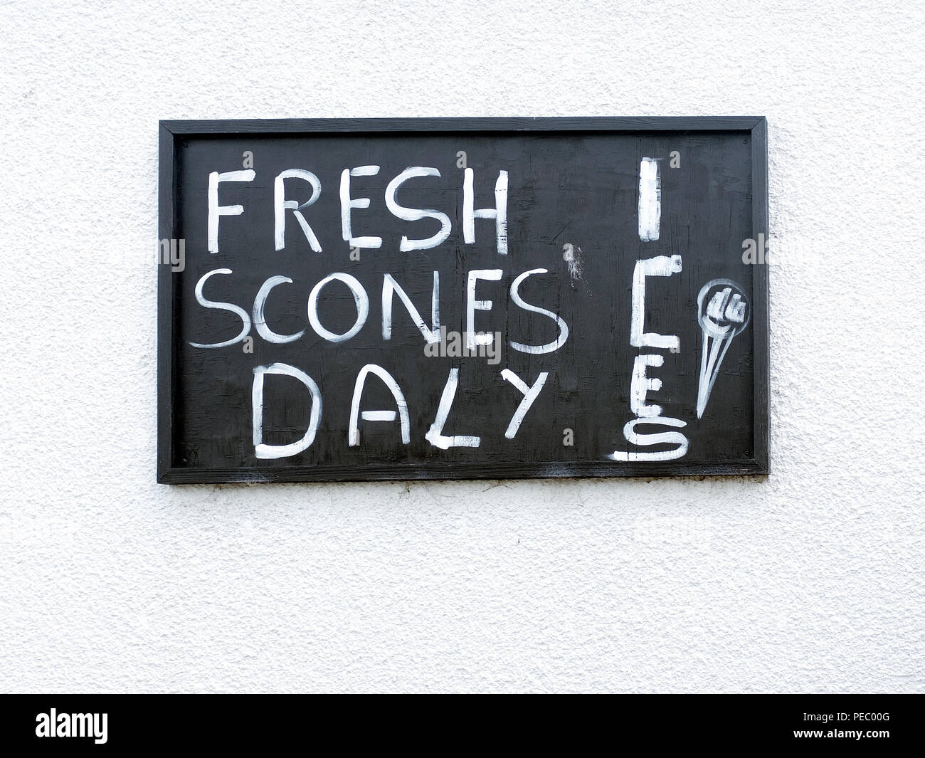 Misspelling of sign - Fresh Scones Daily in Appleby in Westmorland, Cumbria, England, United Kingdom. Stock Photo