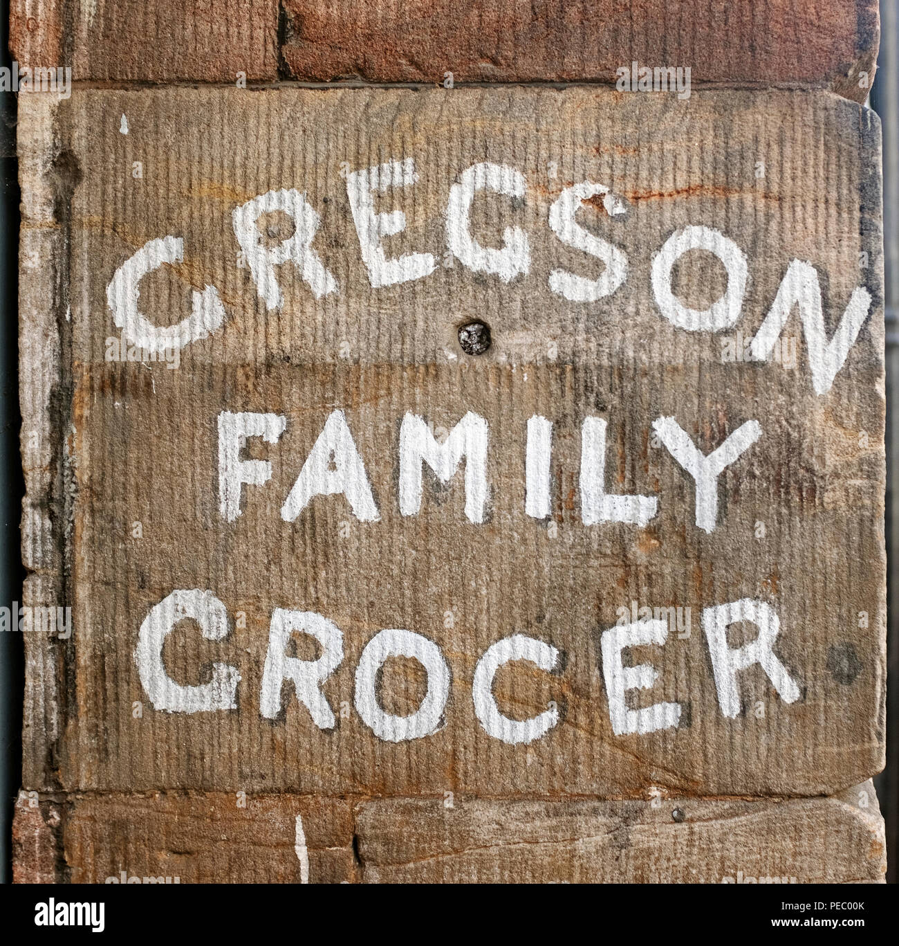 Gregson Family Grocer sign on stonework, Appleby-in-Westmorland, Cumbria, England. United Kingdom. Stock Photo