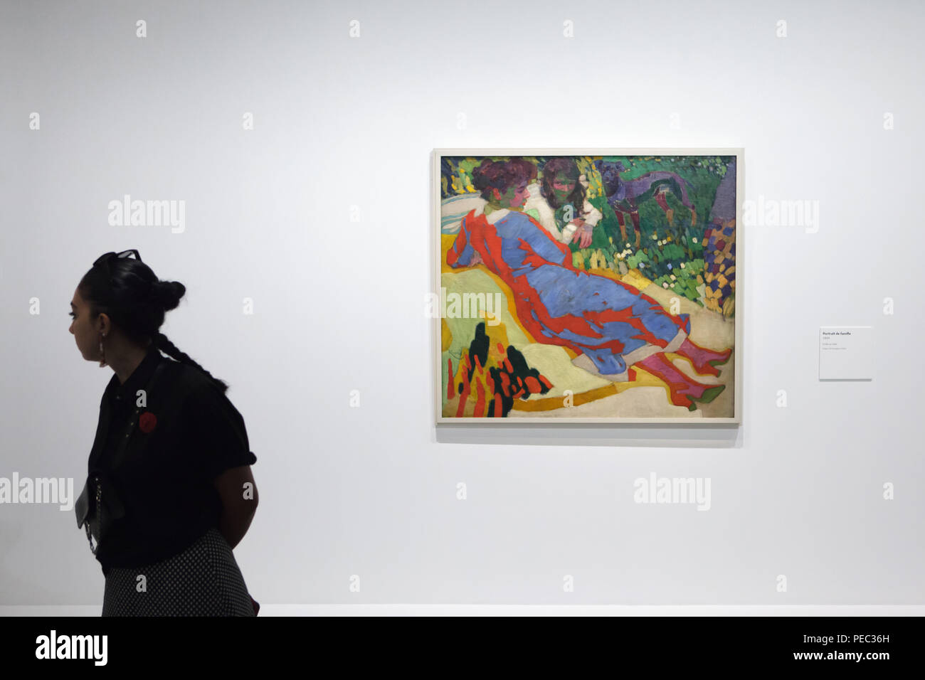 Visitor in front of the painting 'Family Portrait' by Czech modernist painter František Kupka (1910) displayed at his retrospective exhibition in the Grand Palais in Paris, France. The exhibition runs till 30 July 2018. Stock Photo