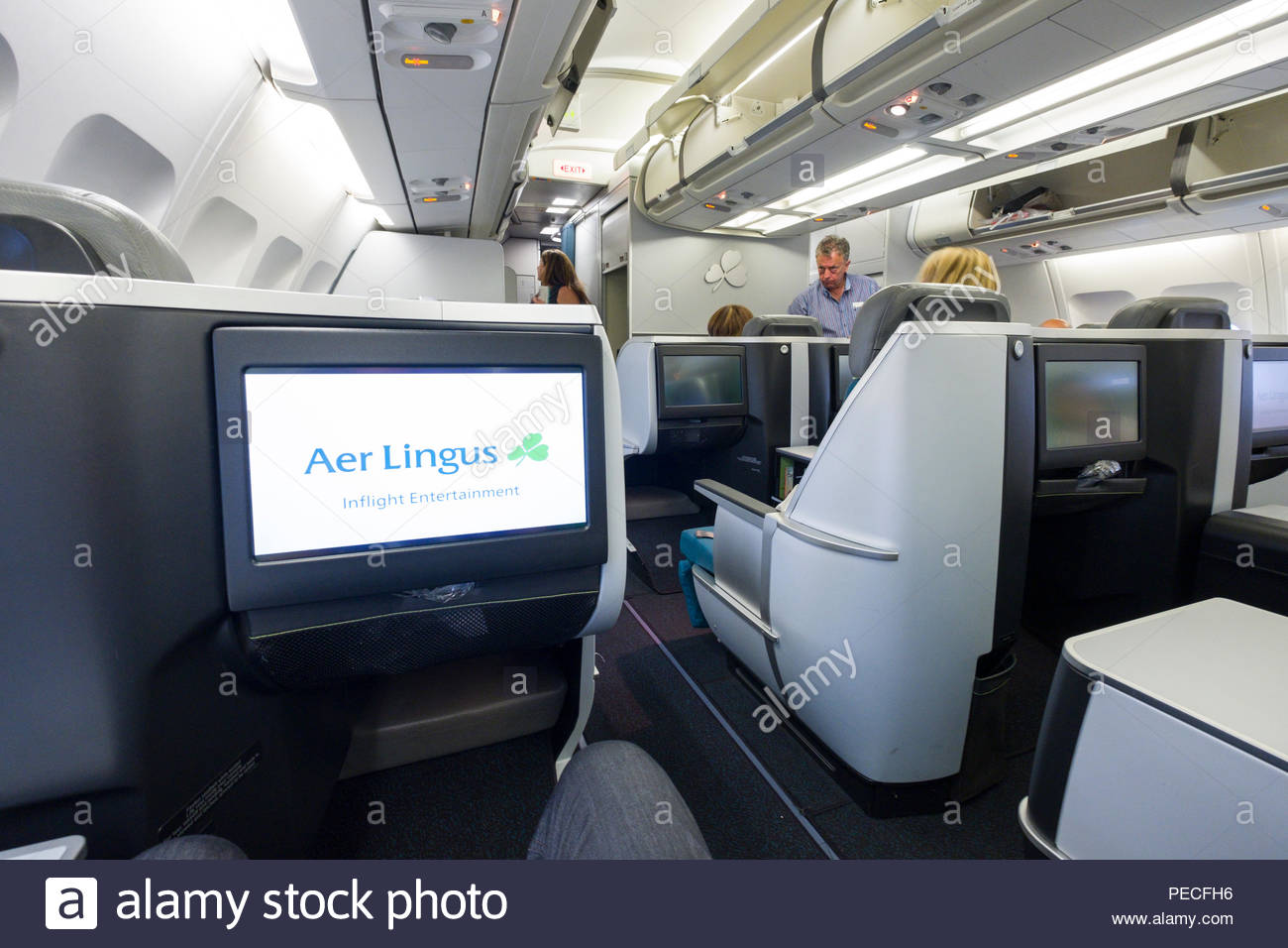 Passengers Sitting In Aer Lingus Lie Flat Seats Aboard An Airbus