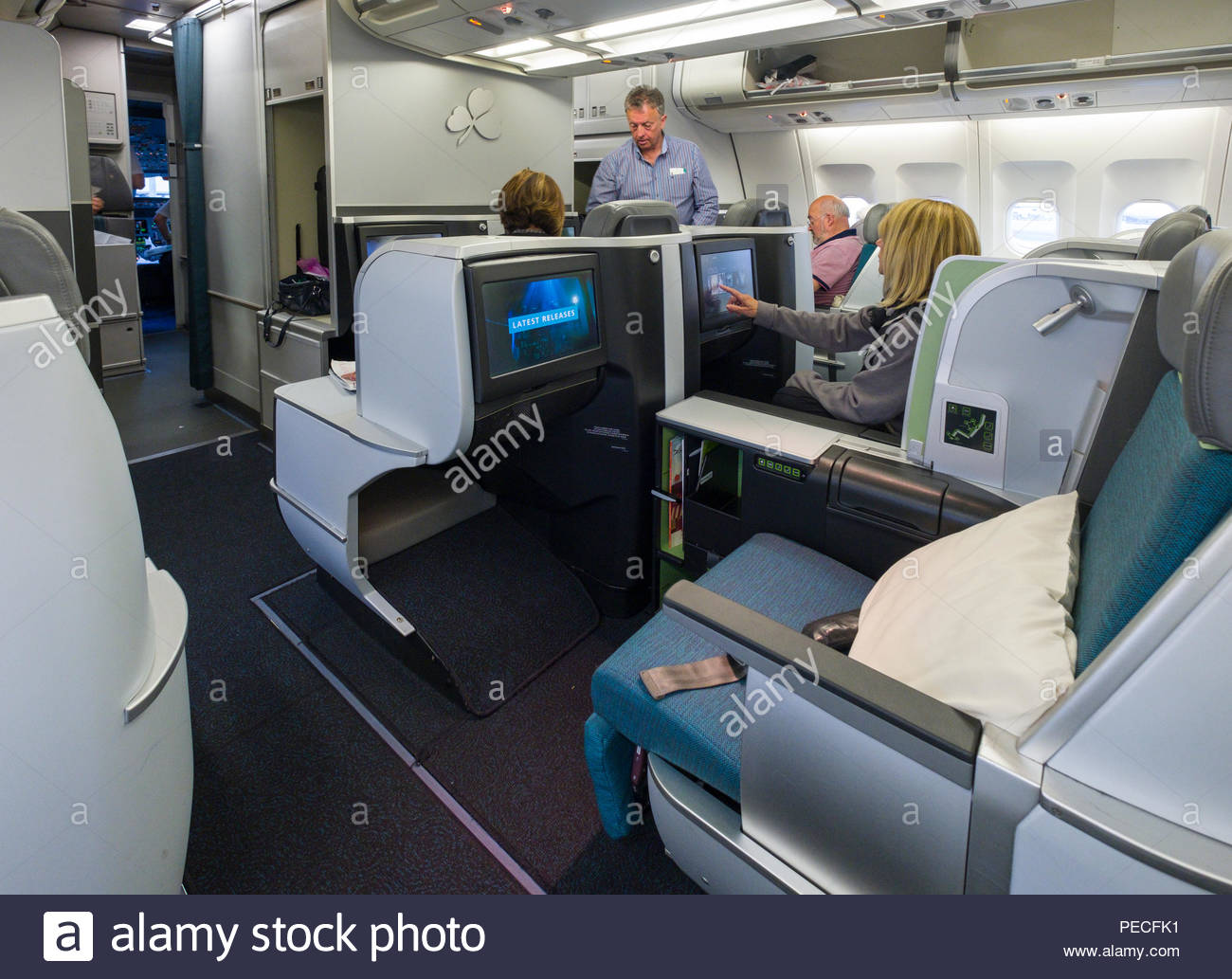 Passengers Sitting In Aer Lingus Lie Flat Seats Aboard An Airbus