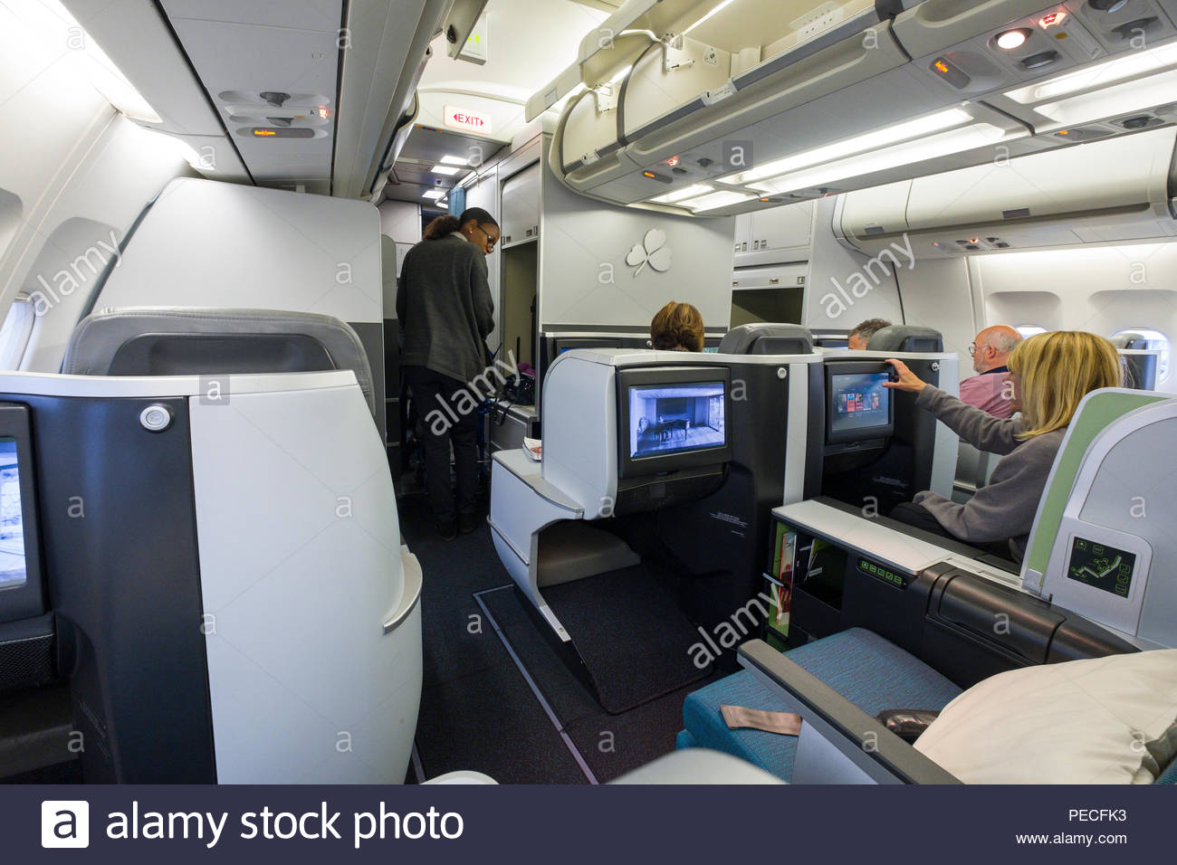 Passengers Sitting In Aer Lingus Lie Flat Seats Aboard An Airbus