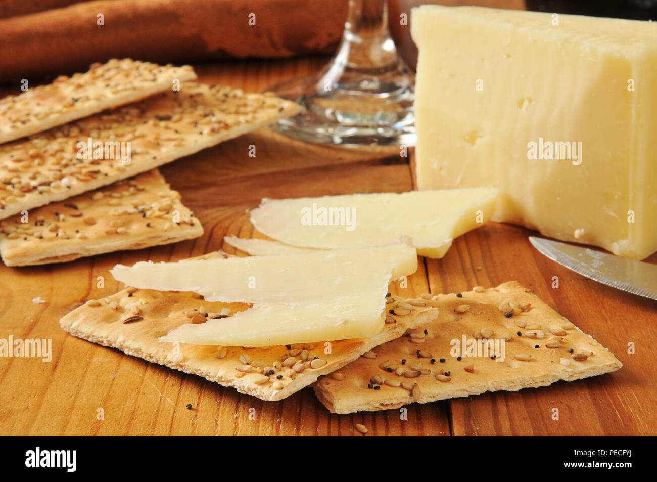 Vermont sharp white cheddar cheese with flatbread crackers Stock Photo