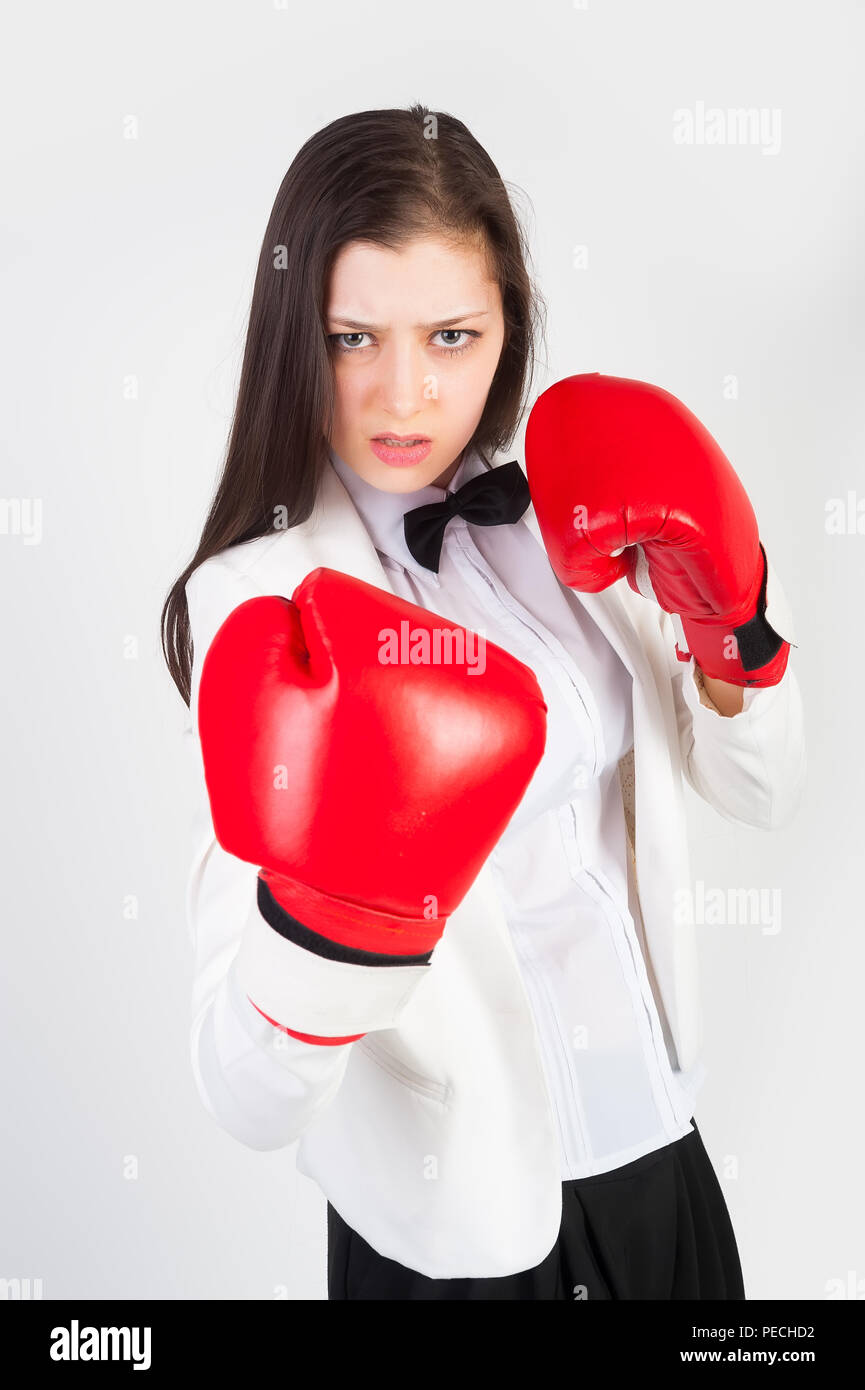 young businesswoman in boxing gloves Stock Photo