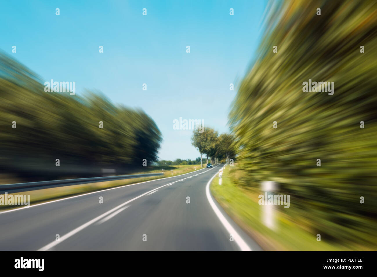 driving fast concept -  motion blur on rural highway Stock Photo