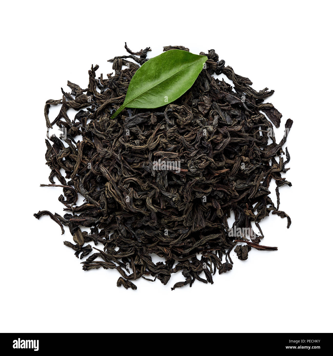 Dried black tea leaves isolated on white background. Top view Stock
